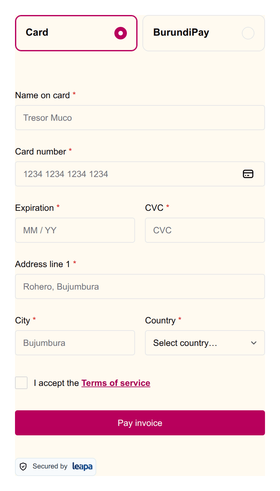 The payment form on a cream background, with the selected Card tile, its radio dot, the terms link and the Pay invoice button all in magenta